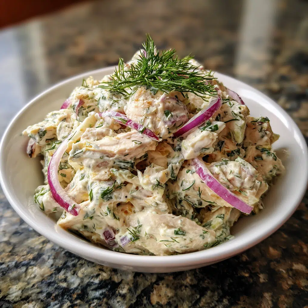 Shredded poached chicken ready to be mixed into dill chicken salad with Greek yogurt.